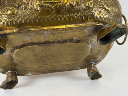 Large jardinière in repoussé brass decorated...