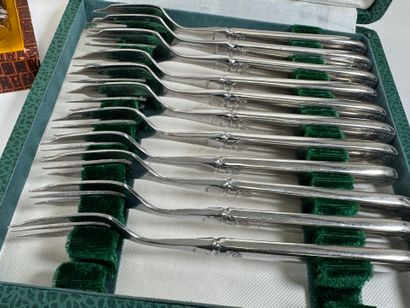 Set of silver-plated flatware with stylized...