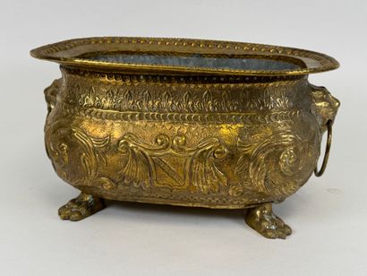 Large jardinière in repoussé brass decorated...