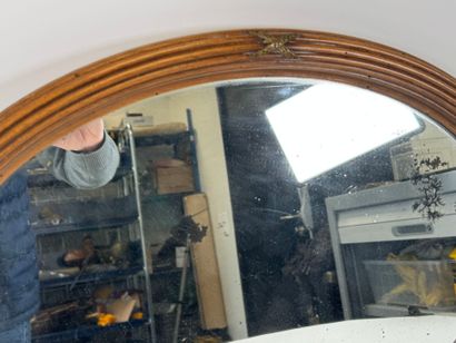Wood and brass oval mirror.
Early 20th century.
63...