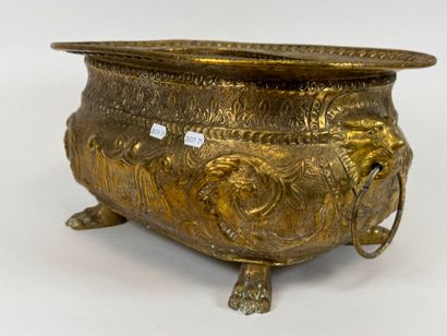 Large jardinière in repoussé brass decorated...