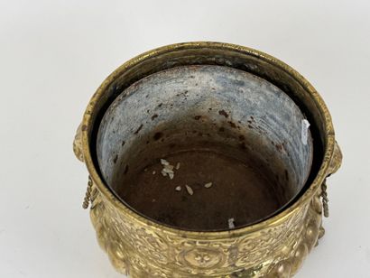 Small circular jardinière in repoussé brass...