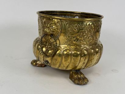 Small circular jardinière in repoussé brass...