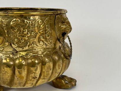 Small circular jardinière in repoussé brass...