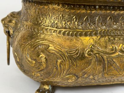 Large jardinière in repoussé brass decorated...