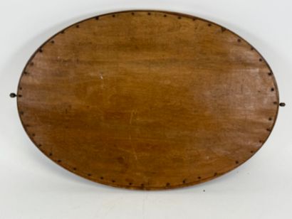 Wood and brass oval mirror.
Early 20th century.
63...