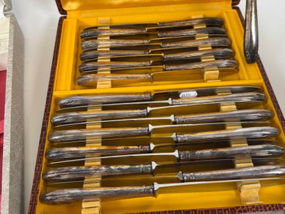 Set of silver-plated flatware with stylized...