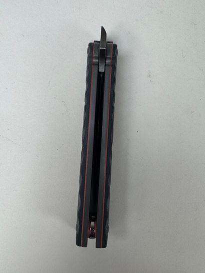 Set of three knives, one of which has an...