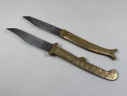 Two large chased brass and metal knives,...