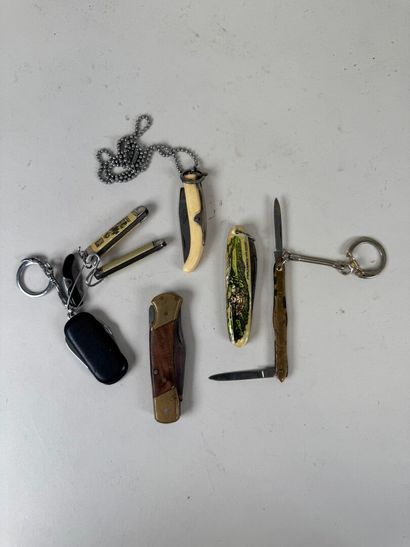 Set of 23 knives, some advertising DUBONNET,...