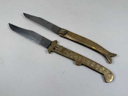 Two large chased brass and metal knives,...