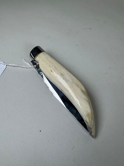 Large metal and bone knife, blade marked...