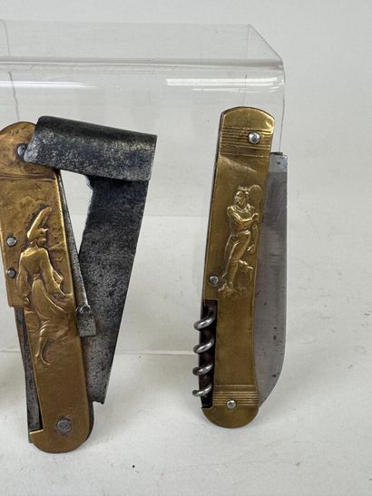 Three brass and steel knives decorated with...