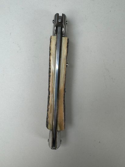 Set of three knives, one of which has an...