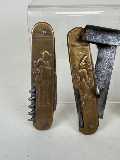 Three brass and steel knives decorated with...