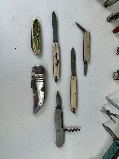 Set of 23 knives, some advertising DUBONNET,...