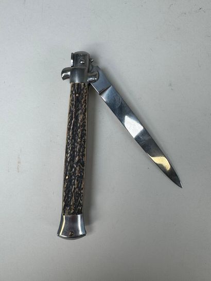 Set of three knives, one of which has an...