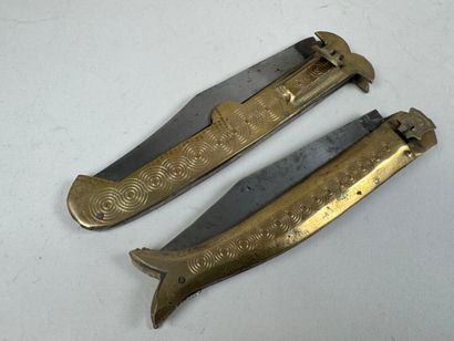 Two large chased brass and metal knives,...