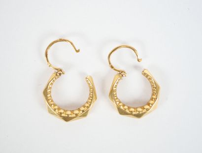 Pair of small faceted hoop earrings in 18K...