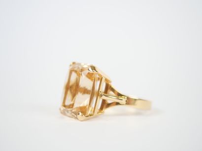 18K yellow gold ring featuring a large faceted...