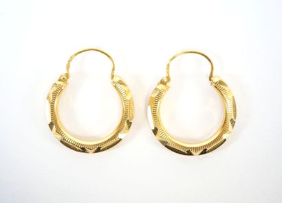 Pair of faceted hoop earrings in 18K yellow...