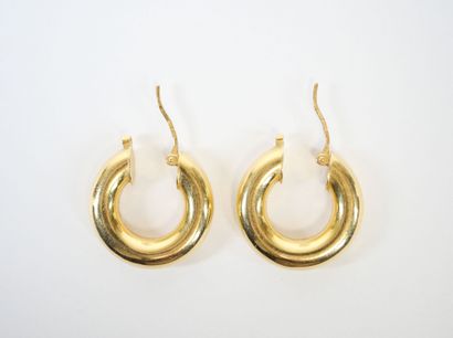 Pair of 18K yellow gold hoop earrings.
Weight:...