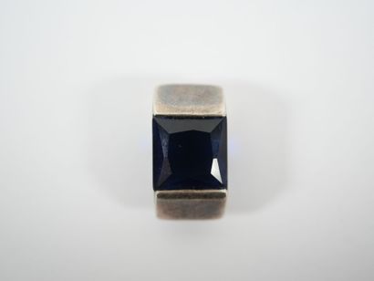 Freeform silver pendant adorned with a square...