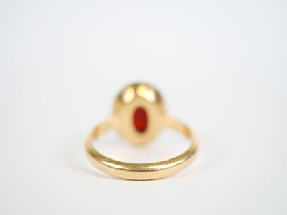 18K yellow gold ring centered with an oval...