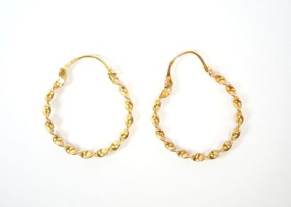 Pair of twisted hoop earrings in 18K yellow...