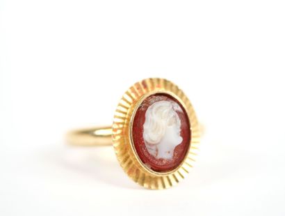 18K yellow gold ring centered with an oval...