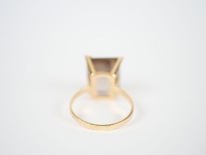 18K yellow gold ring set with a large faceted...