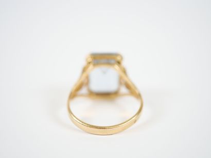18K yellow gold ring centered with a large...