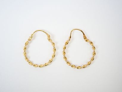 Pair of twisted hoop earrings in 18K yellow...