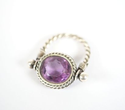 Likely to form a silver ring, with a stylized...