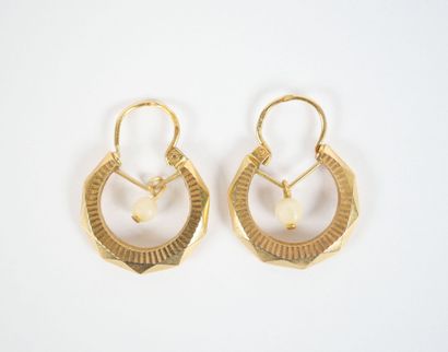 Pair of faceted hoop earrings in 18K yellow...