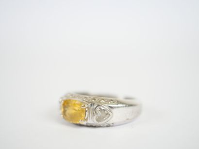 18K white gold ring centered on a probable...