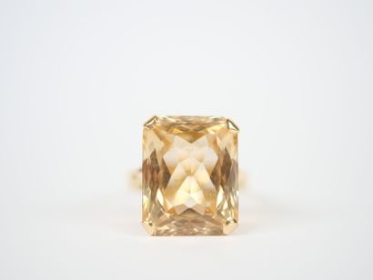 18K yellow gold ring featuring a large faceted...