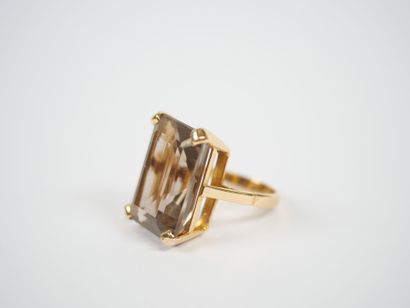 18K yellow gold ring set with a large faceted...