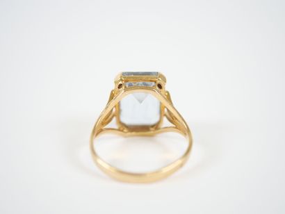18K yellow gold ring centered with a large...
