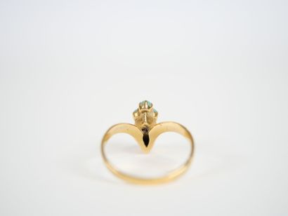 18K yellow gold ring centered on a cultured...