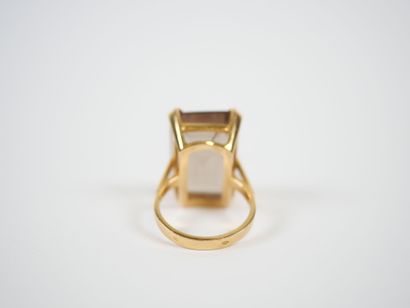18K yellow gold ring set with a large faceted...
