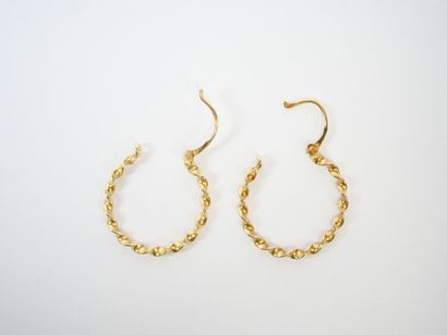 Pair of twisted hoop earrings in 18K yellow...