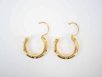 Pair of faceted hoop earrings in 18K yellow...