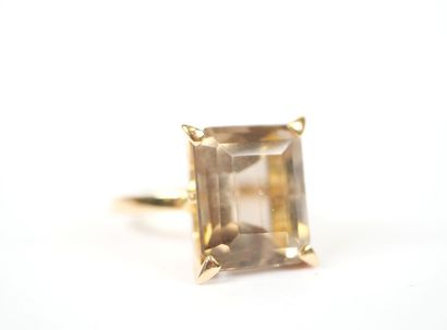 18K yellow gold ring set with a large faceted...