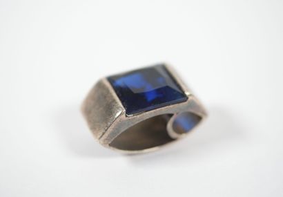 Freeform silver pendant adorned with a square...