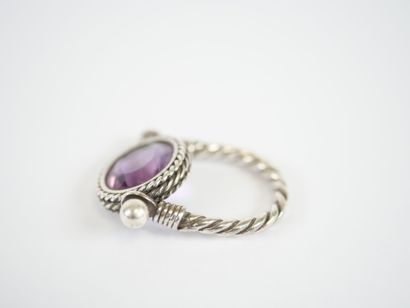Likely to form a silver ring, with a stylized...