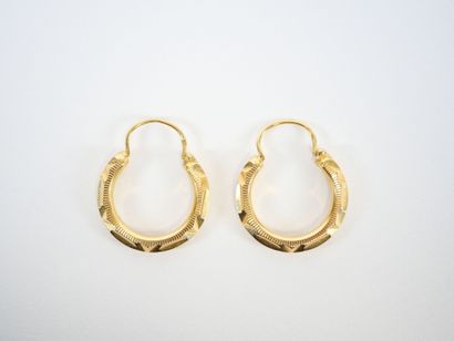 Pair of faceted hoop earrings in 18K yellow...