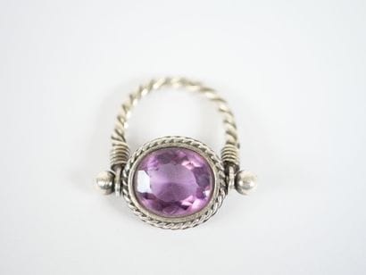 Likely to form a silver ring, with a stylized...