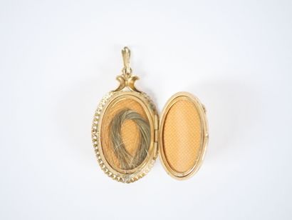 Oval gilded metal pendant-photo holder with...