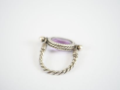 Likely to form a silver ring, with a stylized...